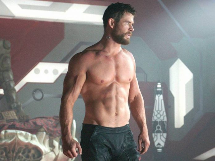 Chris Hemsworth posts photograph of his HUGE ARMS! But fans are SHOCKED to see his THIN LEGS!!!