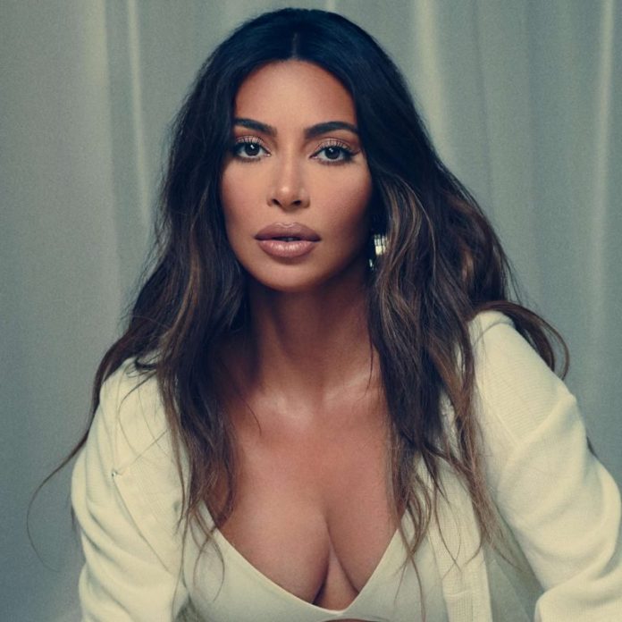 KUWTK: Kim Kardashian Almost Bares It All While Sultrily Posing In Bed With Nothing But A Sheet Covering Her