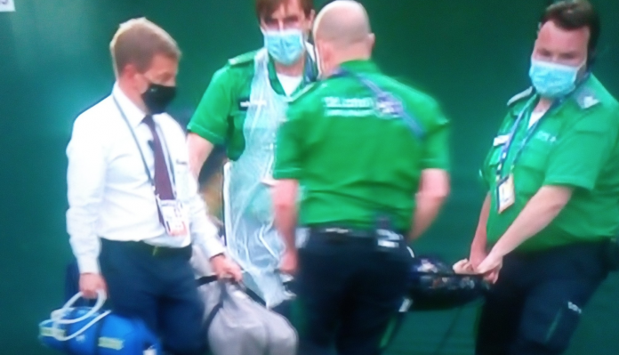 Wimbledon ball kid stretchered off court after slipping on grass